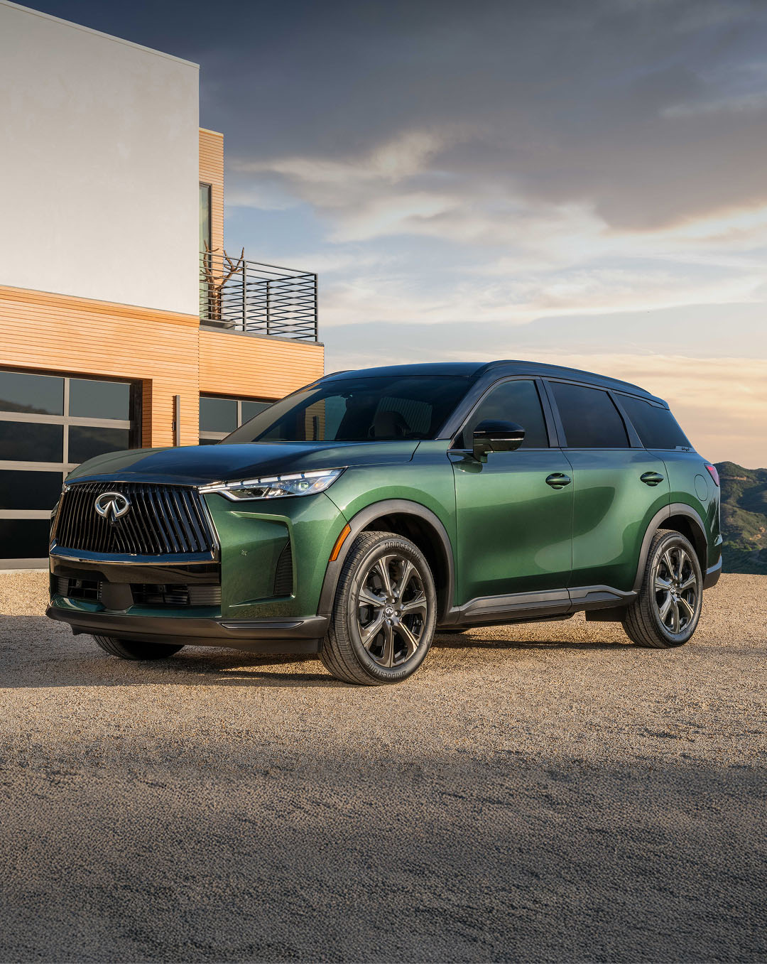 Side profile of INFINITI QX60 in green