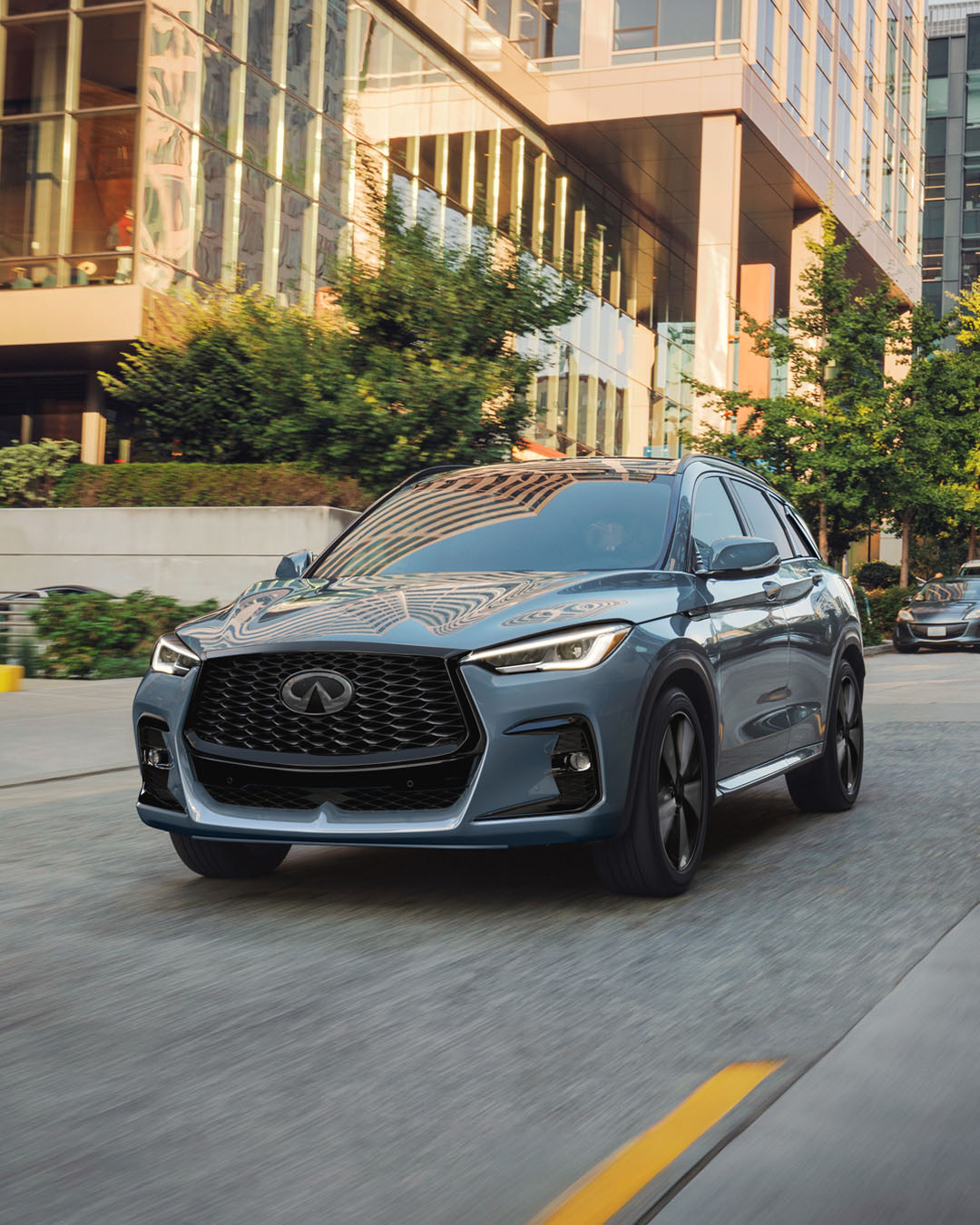 INFINITI QX50 parked in front of office building
