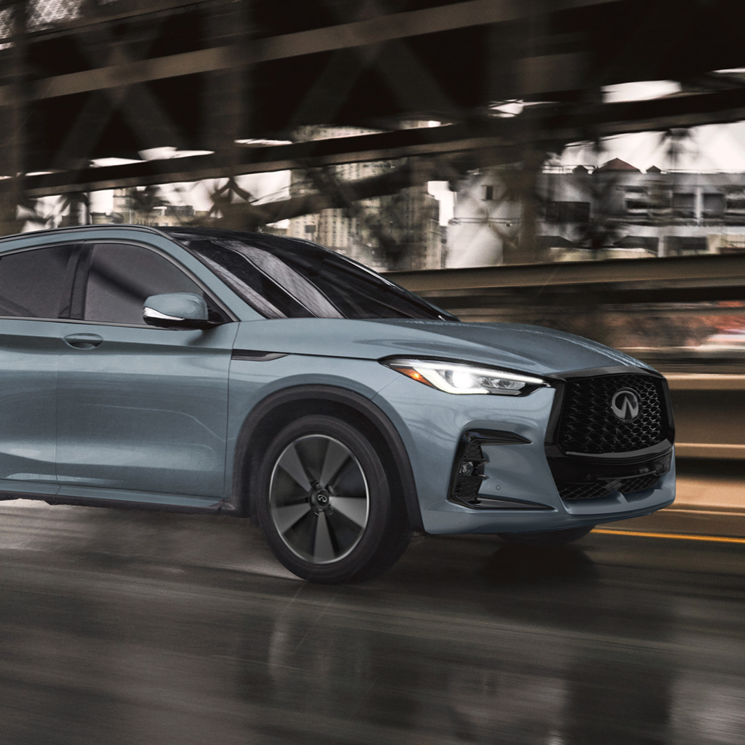 INFINITI QX50 speeding along bridge demonstrating VC-turbo engine