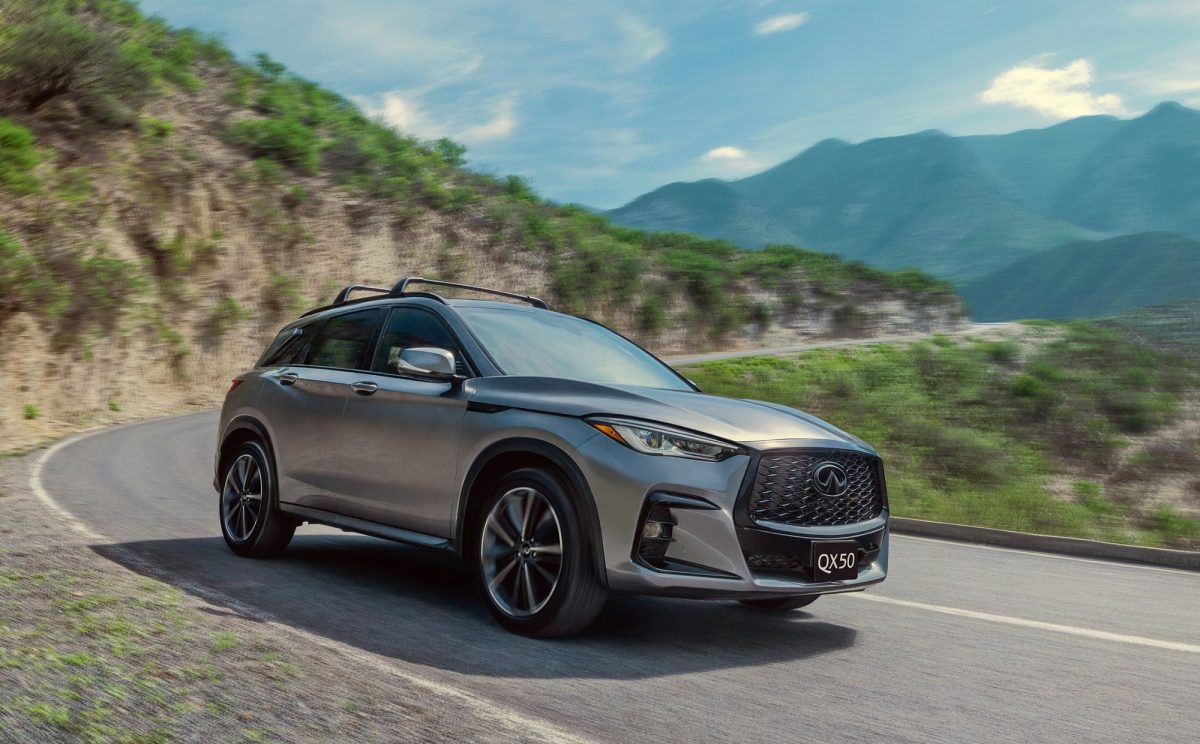 Rear view of 2025 INFINITI QX50 driving through traffic