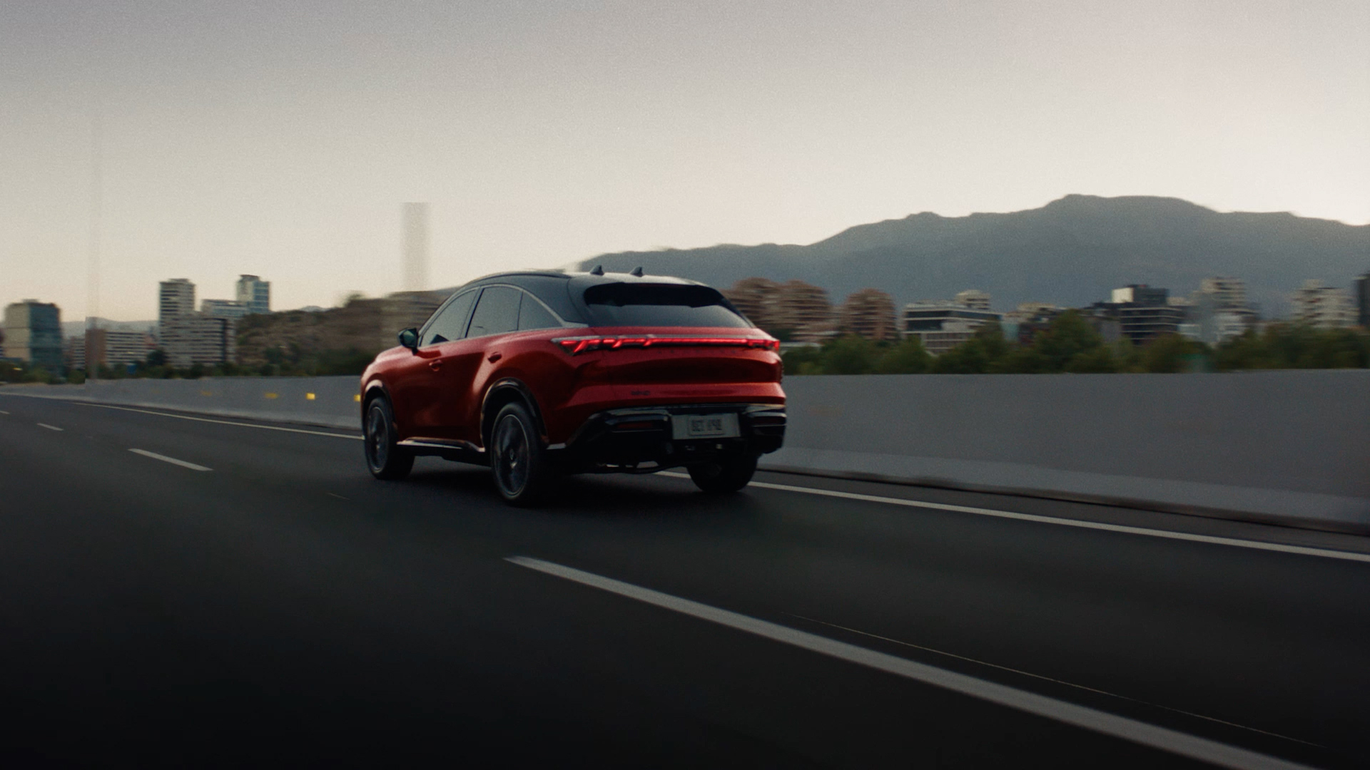Red INFINITI QX65 featuring Blind Spot Warning and Blind Spot Intervention technologies