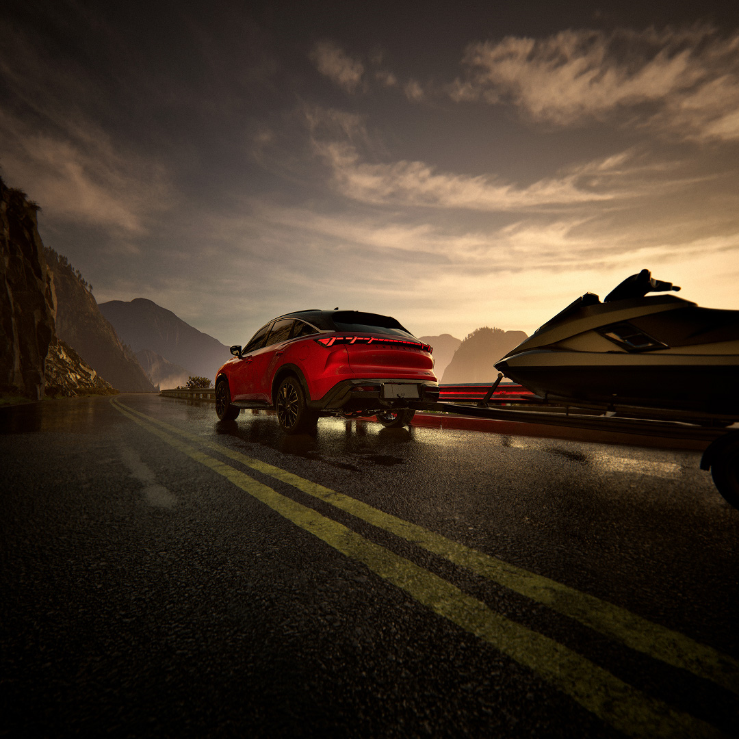 INFINITI QX65 towing on open road highlighting towing performance capability