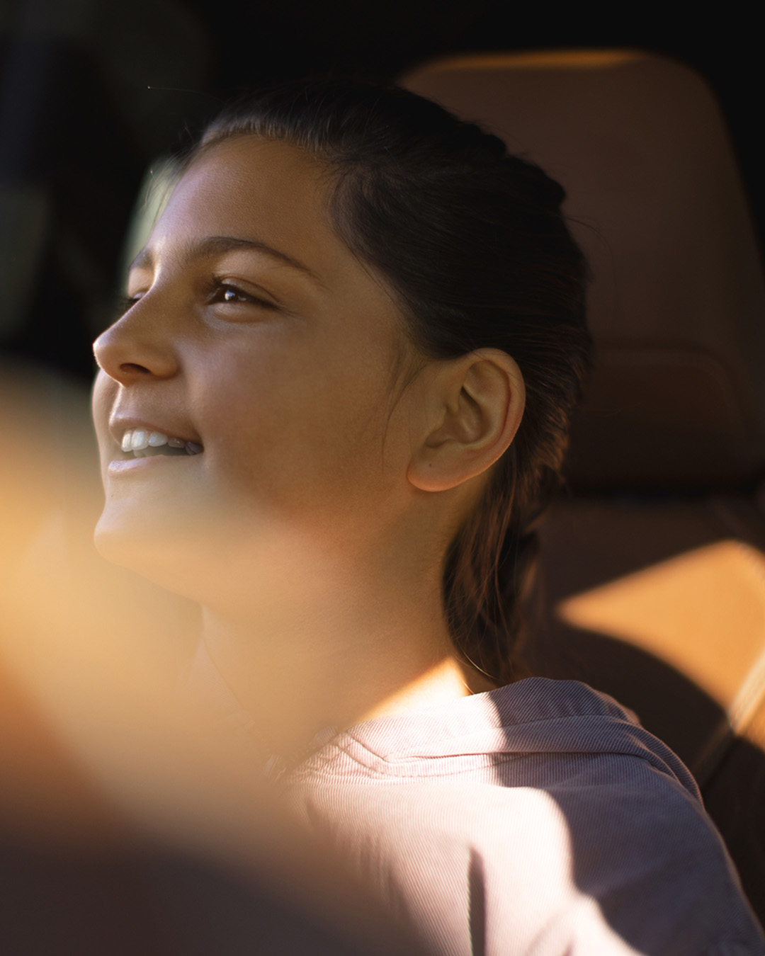 Girl inside cabin enjoying purified air from interior air filtration system