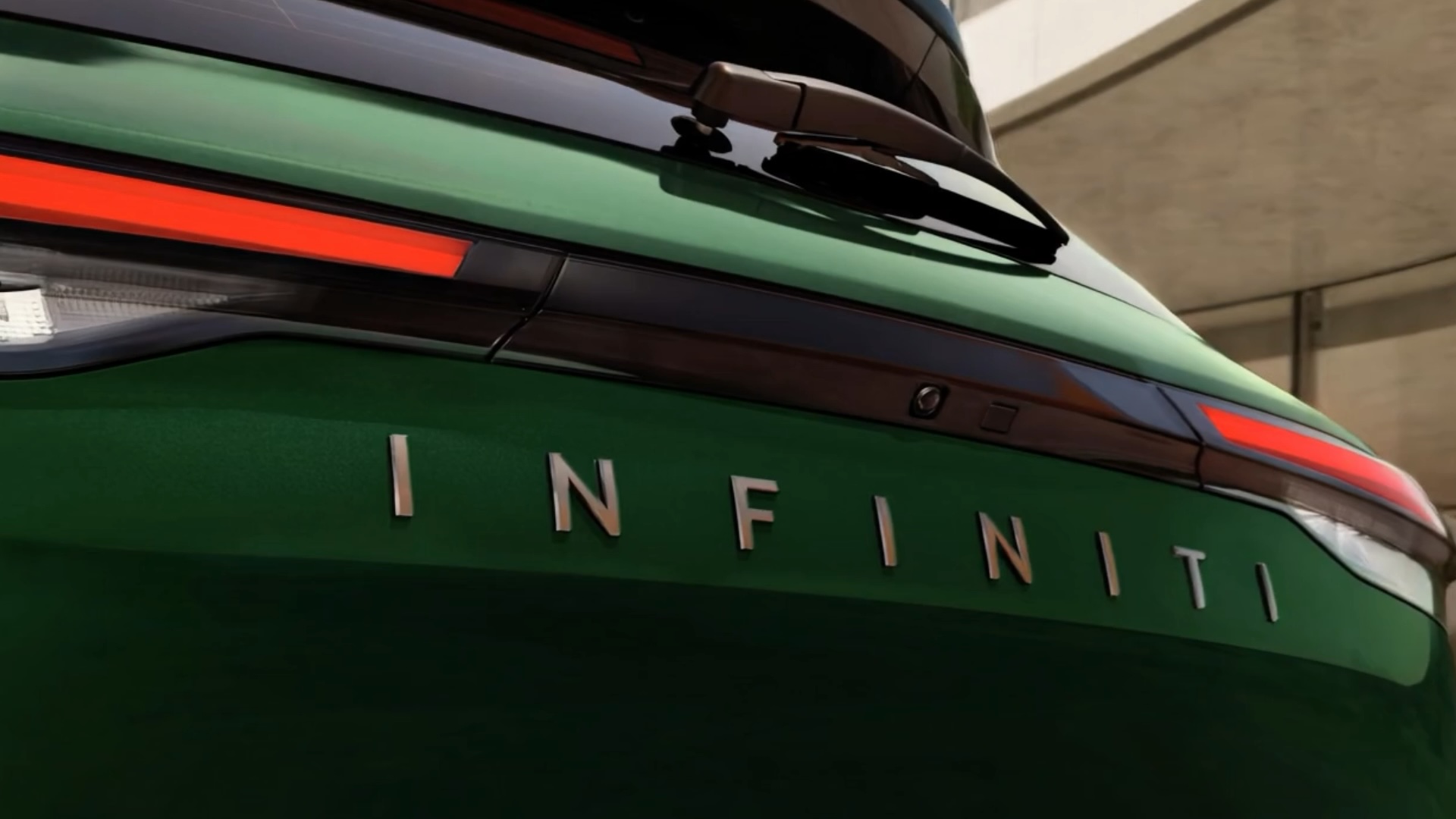 Rear close-up of 2027 INFINITI QX60 showing taillight design and INFINITI lettering