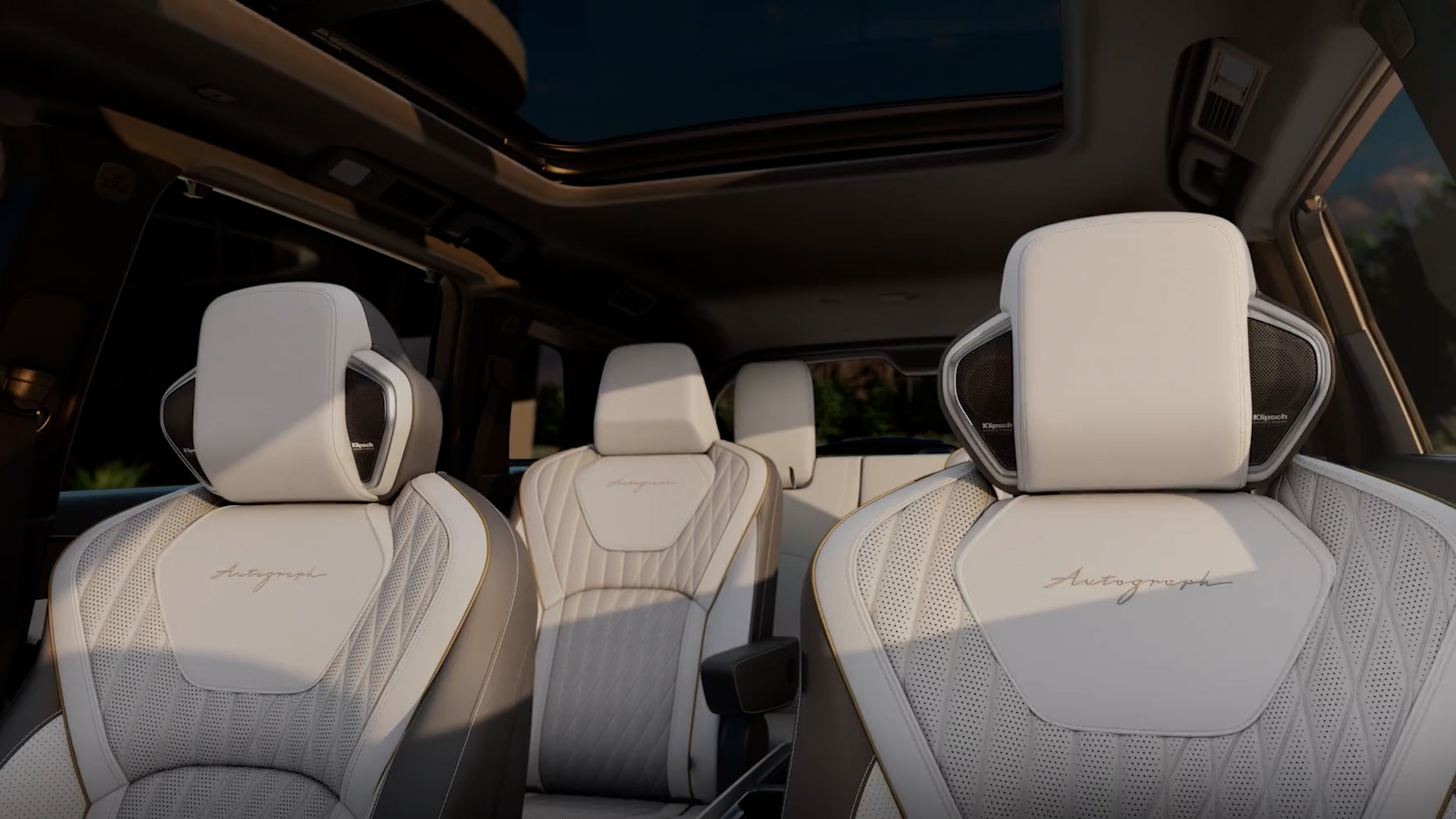 Rear interior of 2027 INFINITI QX60 showing all three seating rows, promoting 7-passenger capacity