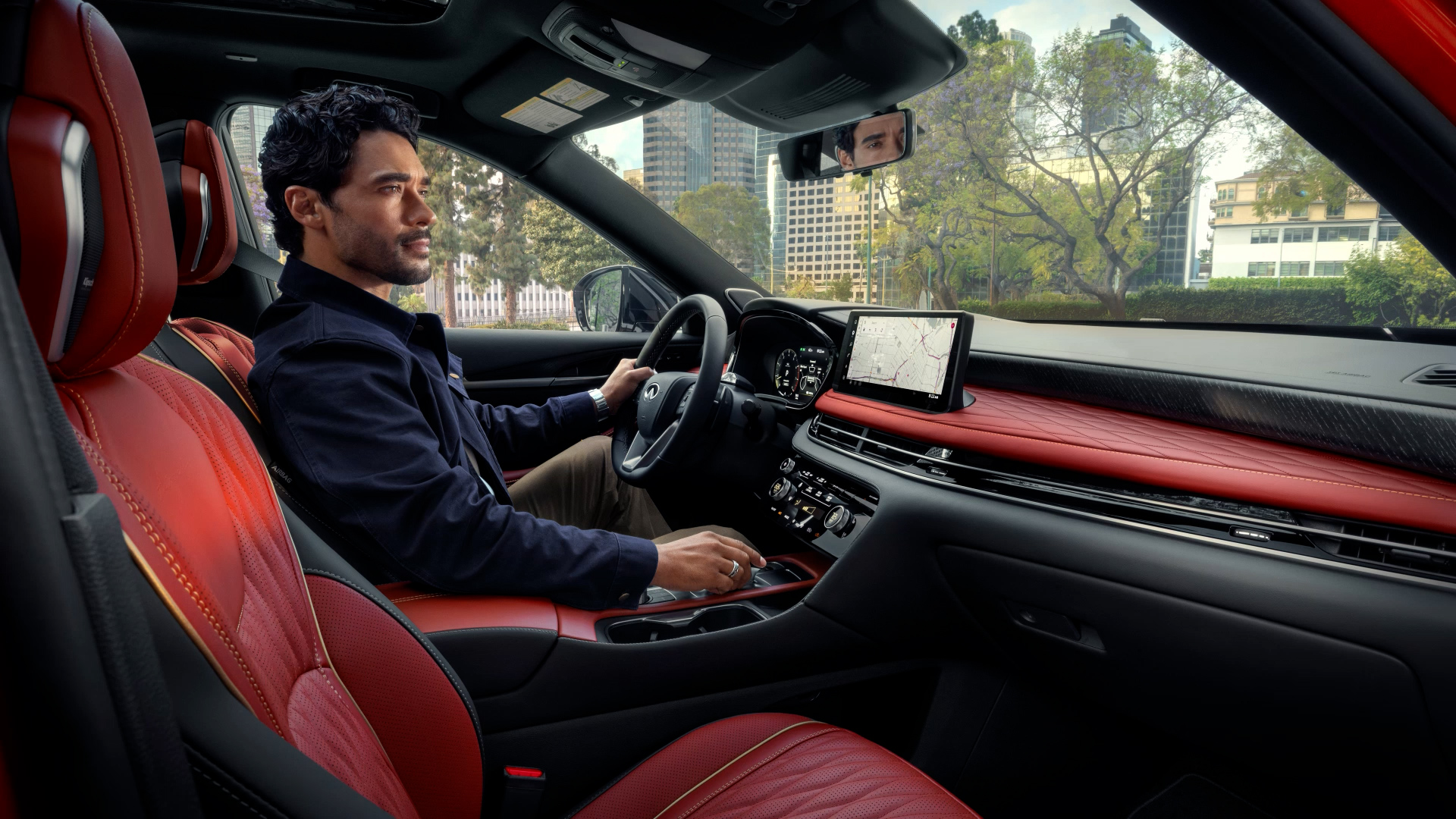 2027 INFINITI QX65 interior with dual displays, center console and quilted seating