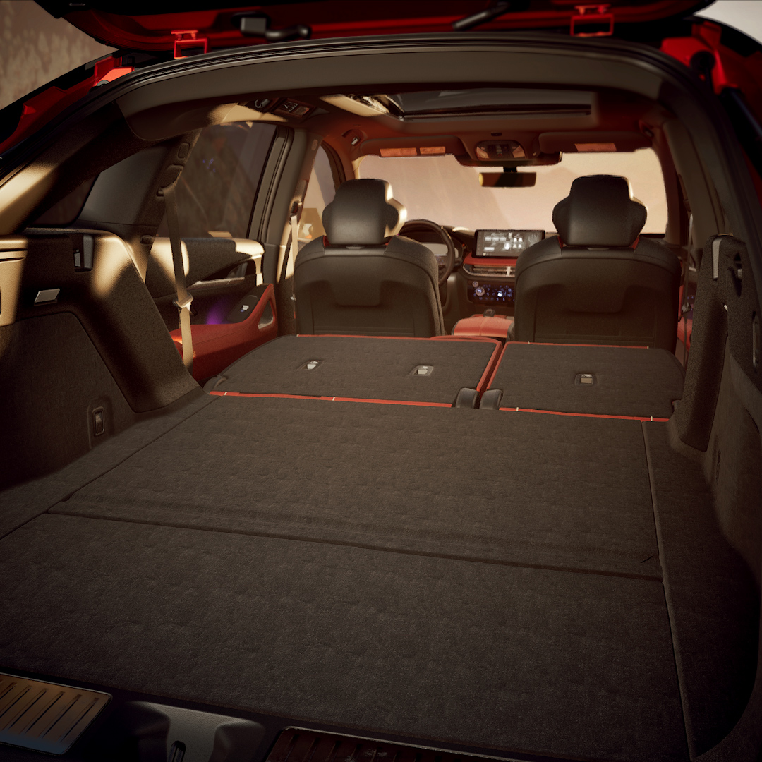 INFINITI QX65 cargo area with rear seats folded to show storage capacity