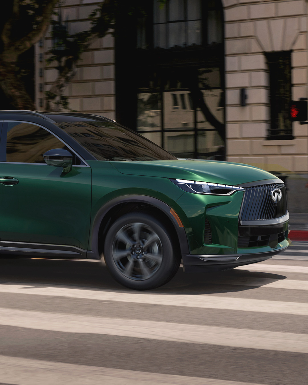 INFINITI QX60 in green, showcasing VC-Turbo engine towing capability