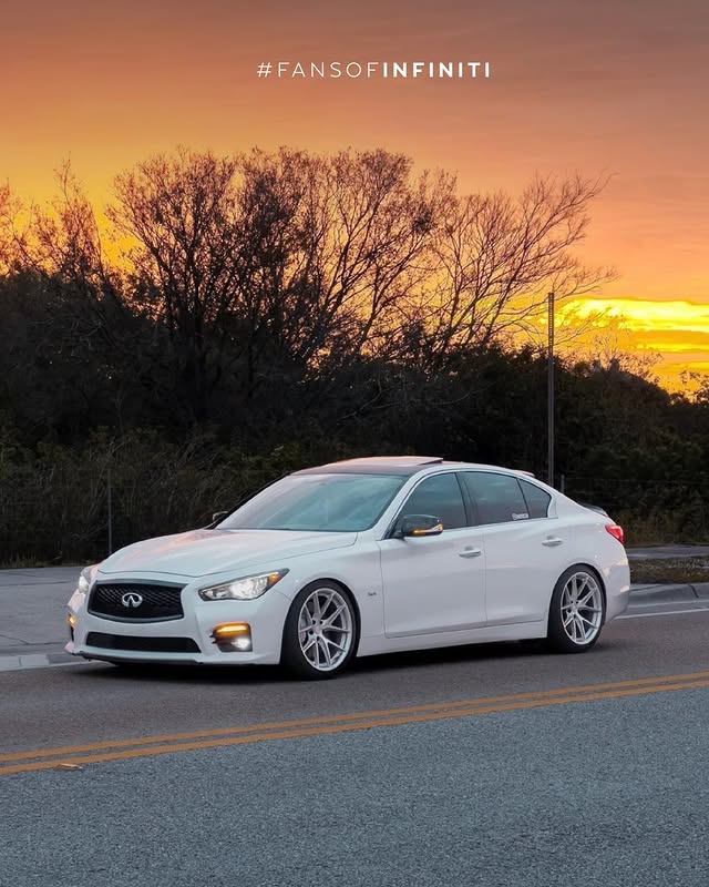 White INFINITI Q50 with sunset in the background