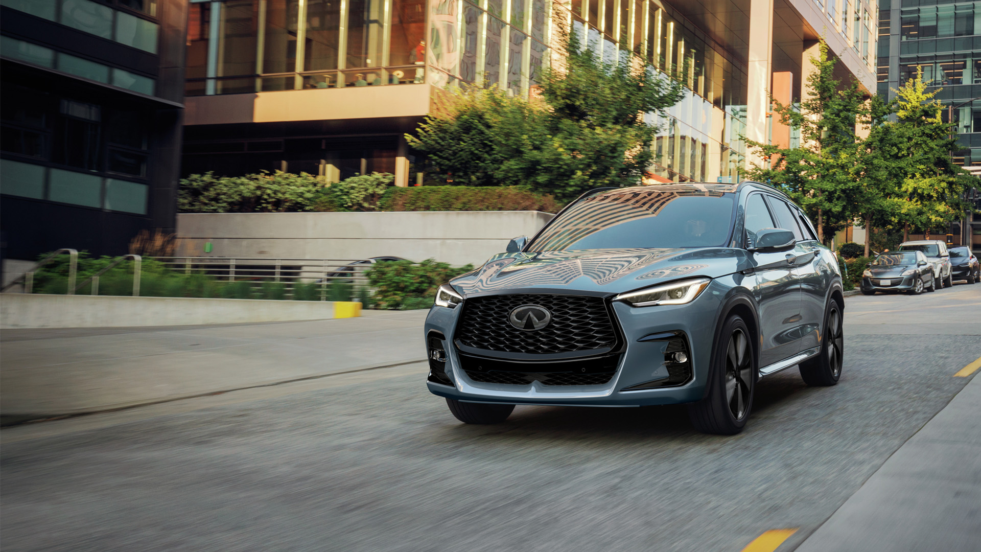 INFINITI QX50 driving on a city street