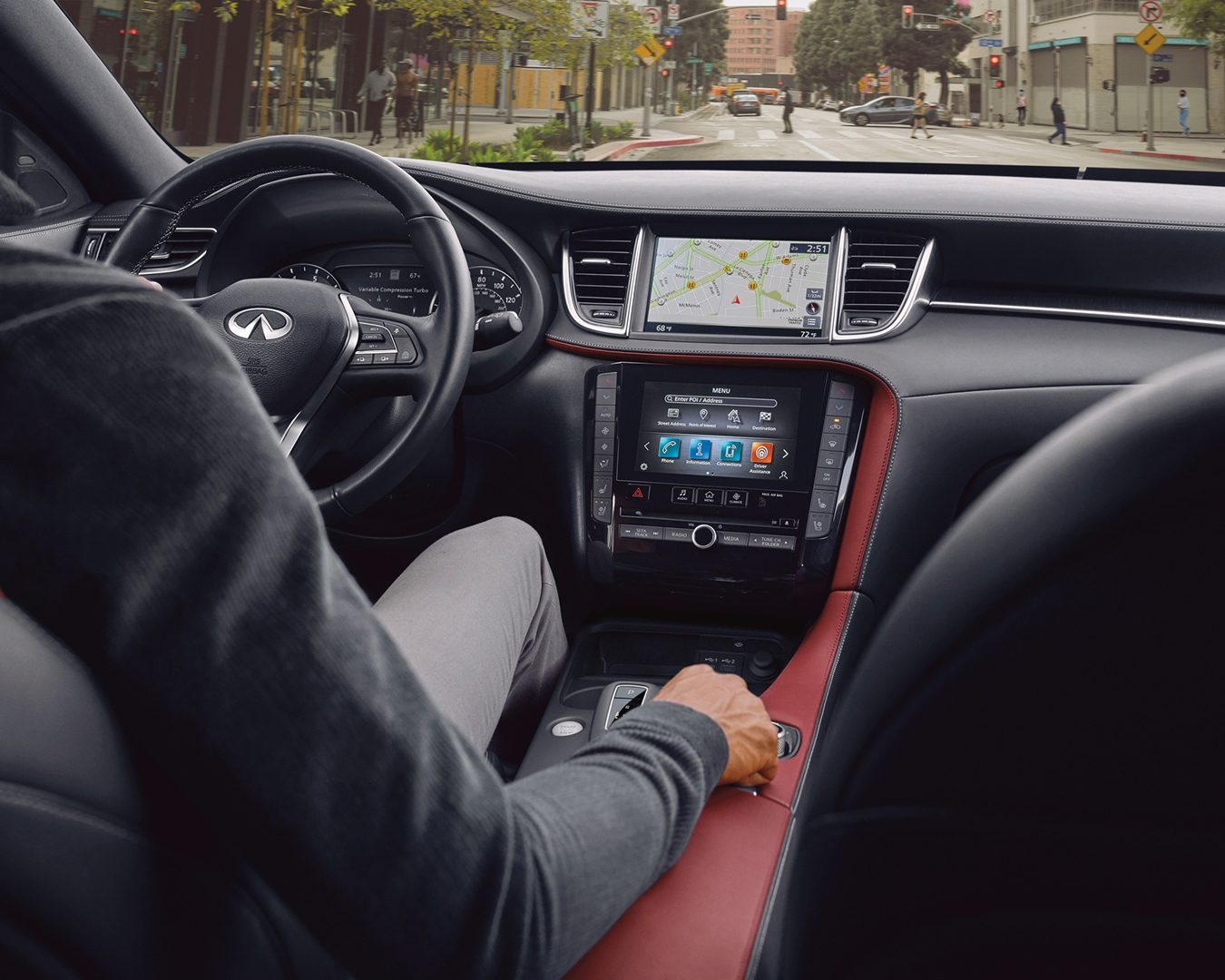 INFINITI QX55 interior with driver-focused cockpit, dual touchscreen displays, and premium materials