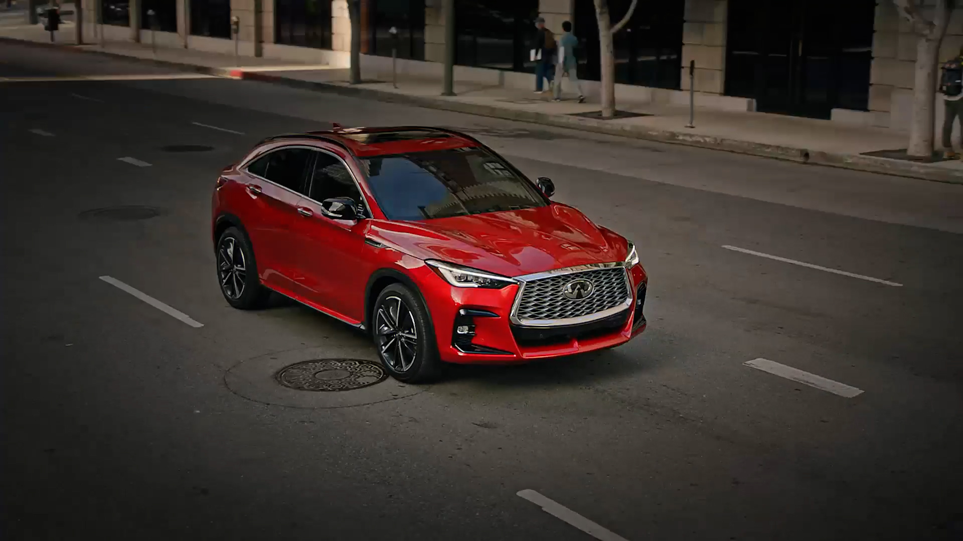 Red INFINITI QX55 luxury crossover coupe showcasing its signature sloping roofline and bold exterior design