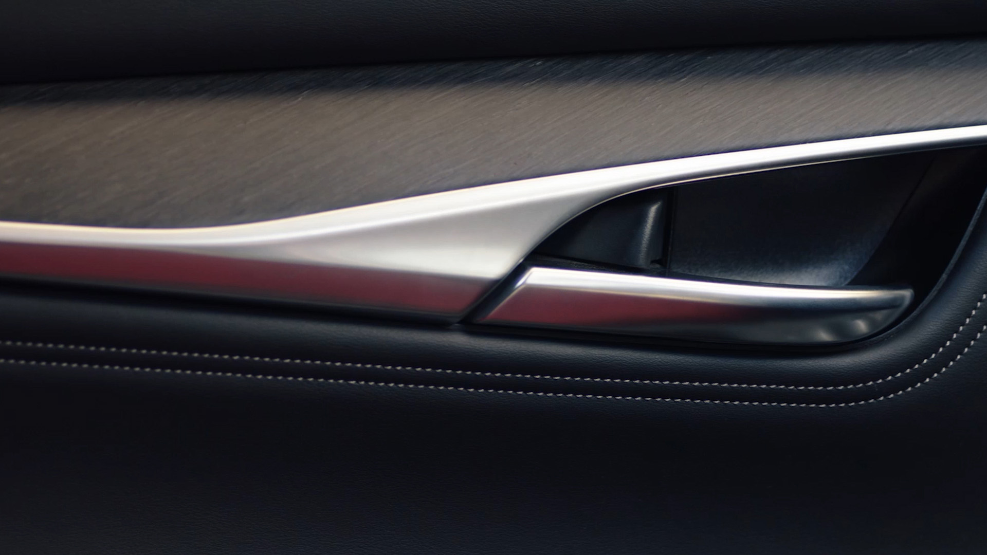 INFINITI QX55 interior trim detail showcasing Japanese-inspired craftsmanship