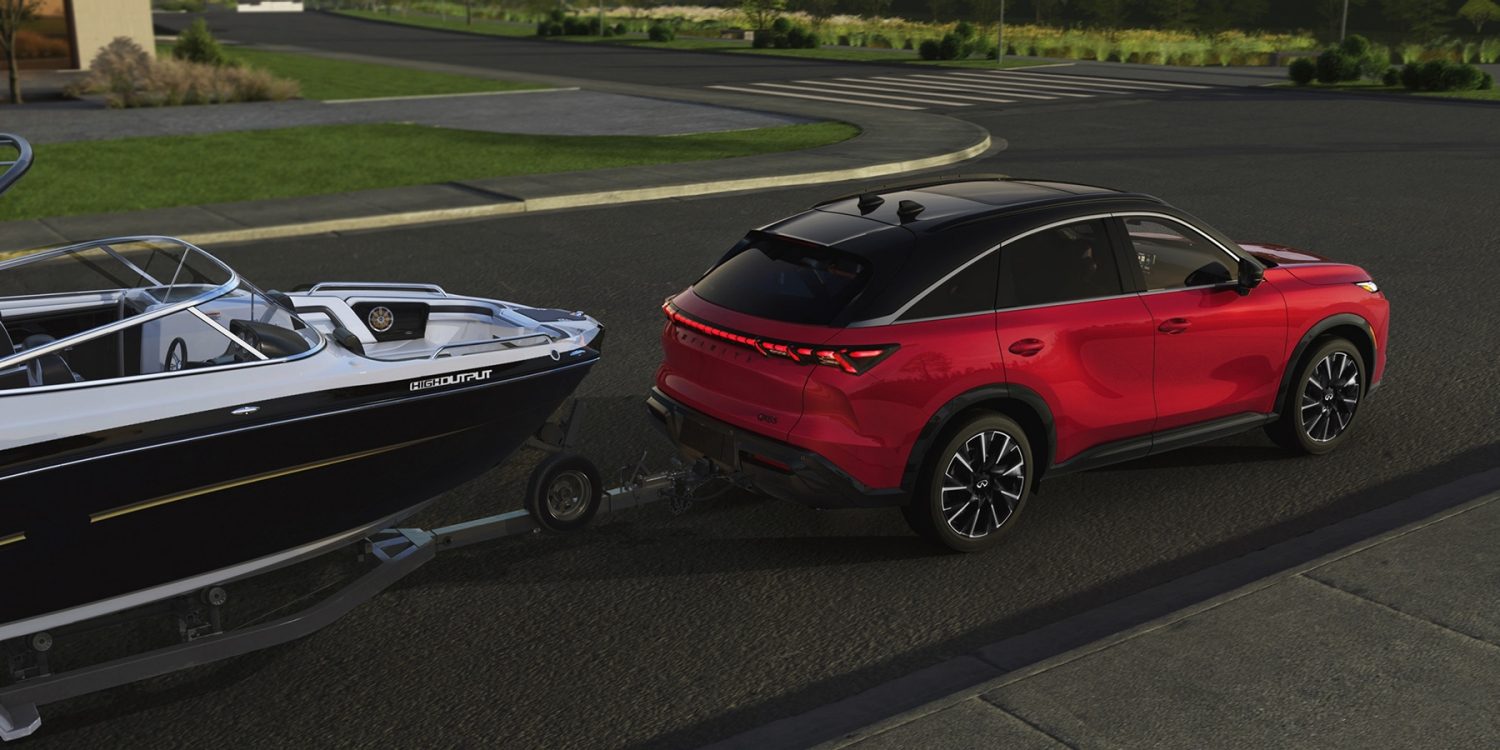 2027 INFINITI QX65 towing a boat with up to 6,000 lbs towing capacity